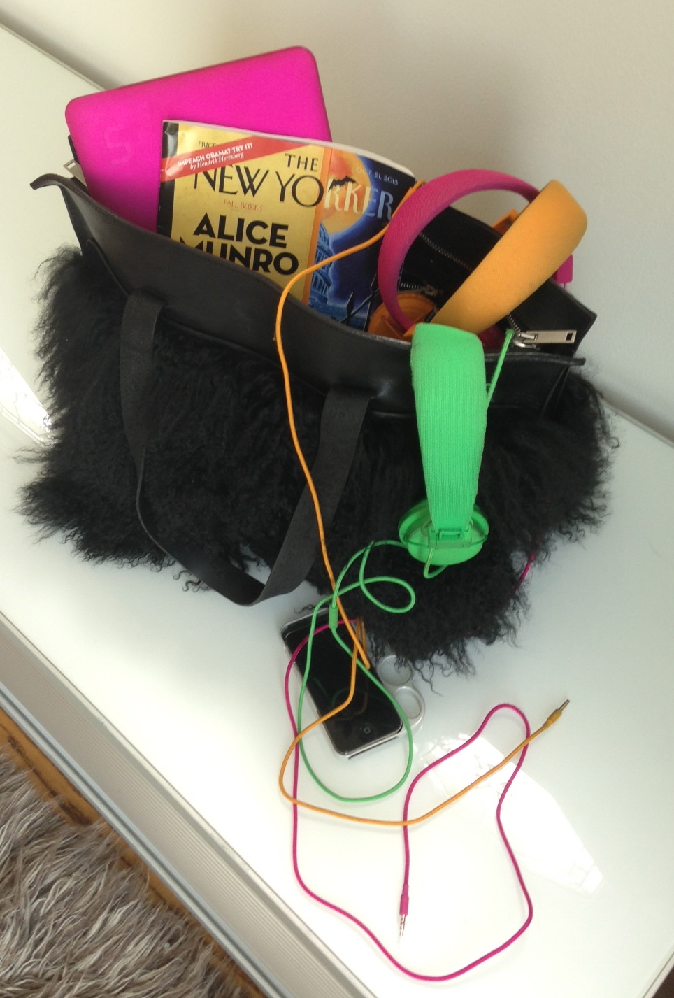 Public Transit survival kit: Gareth Pugh fur bag, Urban Ears Headphones, Knucklecase iphone case.